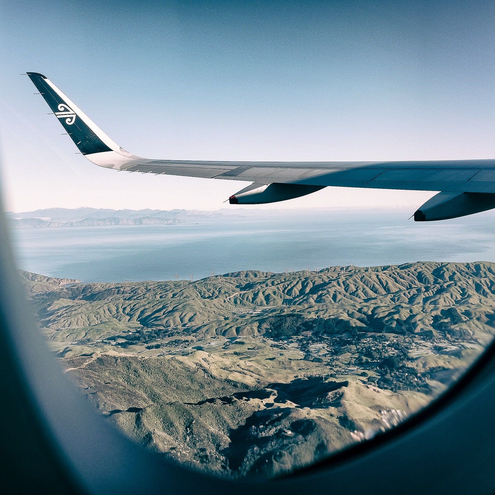Air New Zealand. airplane window. view. mountains